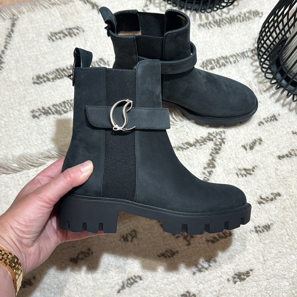 CHRISTIAN LOUBOUTIN
Suede Buckle Red Sole Chelsea Booties